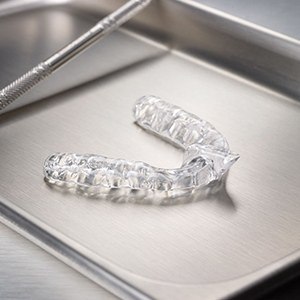 Clear nightguard on metal tray | Mouth Guards and Teeth Cleaning | Best Dentist Andover MA 01810