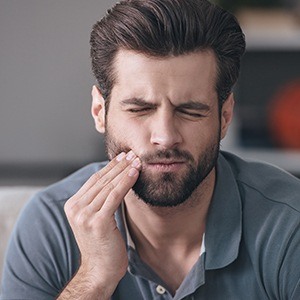 Man in pain holding jaw | Emergency Dentist Andover MA 01810