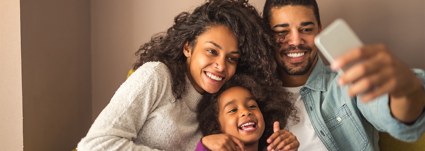 Top Family and Pediatric Dentist Near Andover, MA Smiling mother father and child | Adult and pediatric dentist near Andover MA