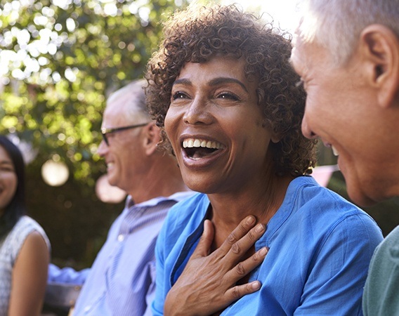 Laughing older woman outdoors | Dental Crowns, Veneers, Root Canals Andover MA 01810